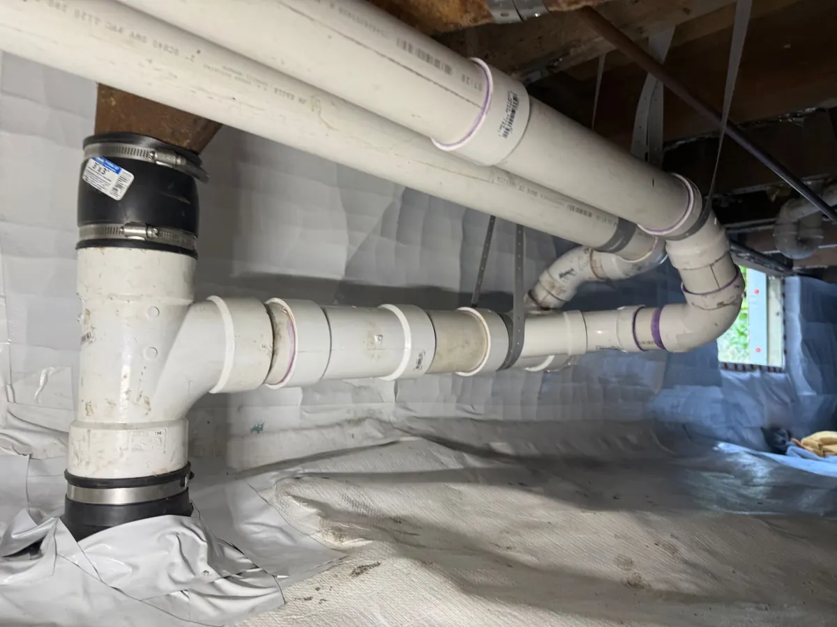 Whole-home repipe in Maryland — EMC Response PVC drain, waste and vent system installed in an encapsulated crawlspace
