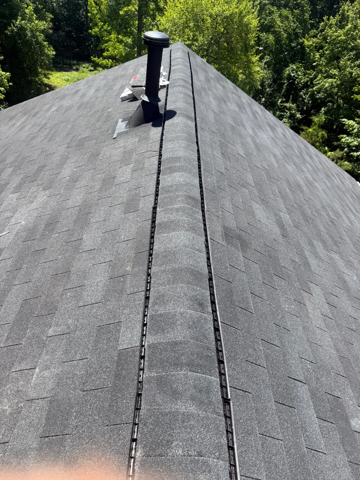 Completed Maryland roof replacement by EMC Response with a continuous ridge vent and uniform architectural shingle field